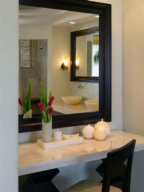 See more ideas about home decor, decor, mirror frames. Elegant Stone Makeup Vanity With Black Framed Mirror | HGTV