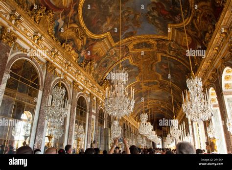 The Richly Decorated Ceiling Of The Grande Galerie Hall Of Mirrors