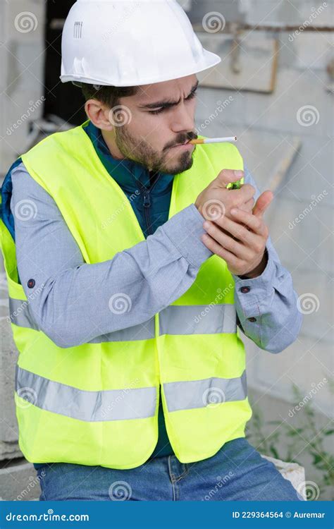 Builder Smoking Cigarette On Construction Site Stock Photo Image Of