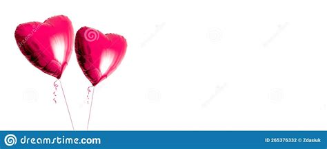 Two Beautiful Red Heart Shaped Balloons With Ribbon Isolated On A White