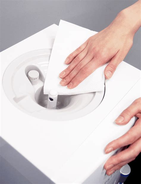 Let the mixture sit overnight, before rinsing thoroughly or running through the dishwasher. How to Clean Water Dispensers - The Frisky