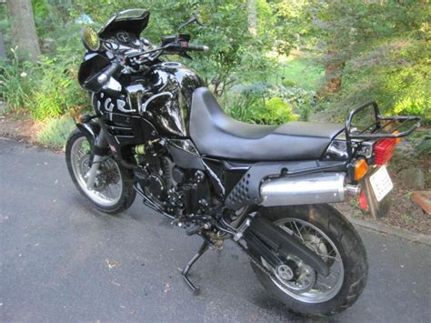 Heated grips, bark busters, head light protector, givi windscreen, radiator protector, aluminum bash plate, moto crash bars, spot lights, side stand fat boy. 1995 Triumph 900 Tiger for sale on 2040-motos