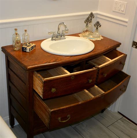 Add style and functionality to your bathroom with a new bathroom vanity. Repurposed Antique Dresser turned into a Bathroom Sink Vanity