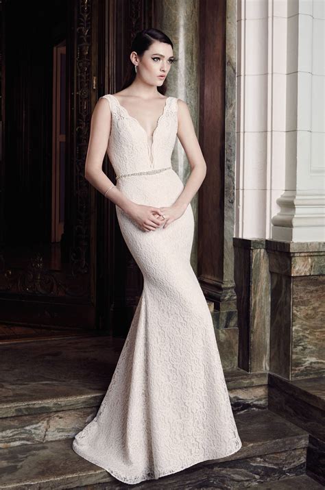 A dramatic wedding dress with wow factor. Plunging Lace Wedding Dress - Style #2016 | Mikaella Bridal