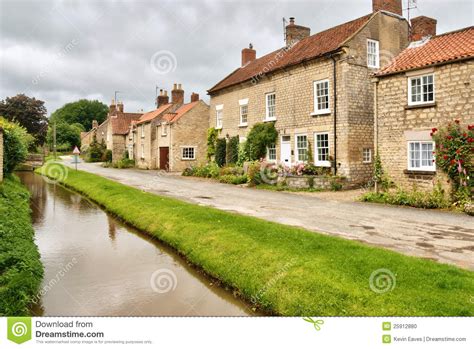 Quaint Cottages And Stream In An English Village Stock Photo Image Of