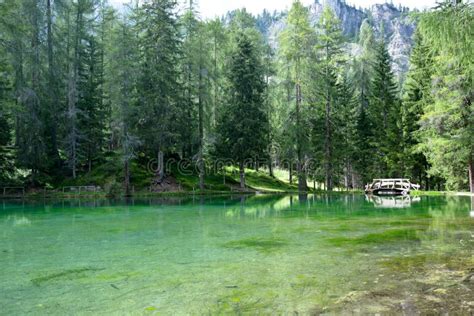 A Beautiful Mountain Lake With Crystal Clear Emerald Colored Water