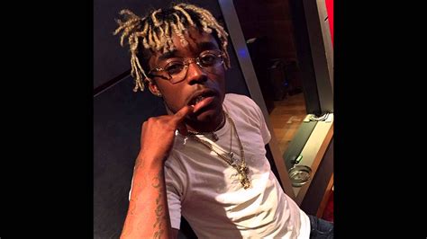 Lil Uzi Vert Is Having Finger Inside Mouth Wearing White Tshirt And Chains Hd Music Wallpapers