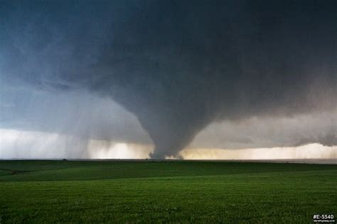 A Large Strong Ef4 Tornado Looms Over Green Kansas Prairie Near The
