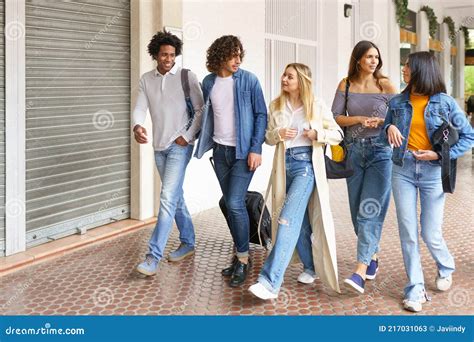 Multi Ethnic Group Of Friends Walking Together On The Street Stock