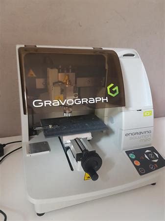 Of screeds 1, at a distance from the ground, mounted on a fixed metal bench movement lateral. MACHINE A GRAVER M20 2016 NEUVE: GRAVOGRAPH à 5400 ...