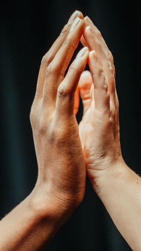 Close Up Of Two People Touching Each Others Hands · Free Stock Photo