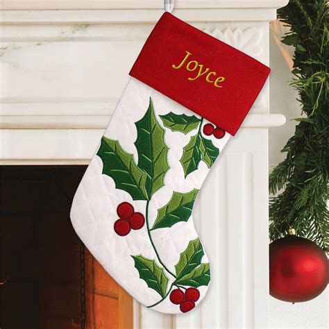 festive holly leaves makes this unique christmas stocking a must for santa to fill with goodies