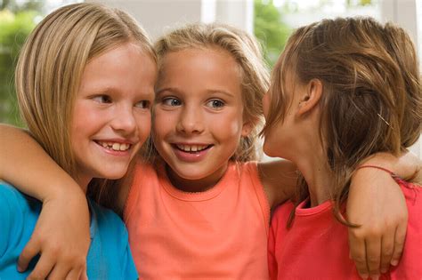 Three Girls Standing Side By Side And License Image 70058682