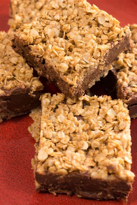 Pour the chocolate mixture over the crust in the pan, reserving about 1/4 cup for drizzling and spread evenly. No Bake Chocolate Oatmeal Bars | TheBestDessertRecipes.com