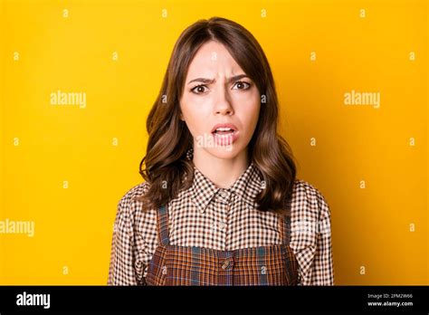 Photo Portrait Of Girl Unhappy Unsatisfied Wearing Checkered Outfit Isolated On Vibrant Yellow