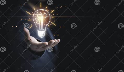 Businessman Holding Half Of Virtual Lightbulb And Brain On Blue Bokeh