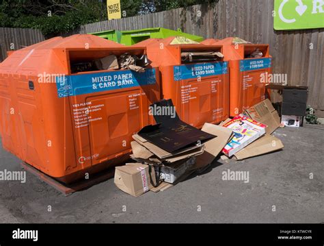 Full Cardboard Recycling Bins With More Cardboard Dumped On The Floor