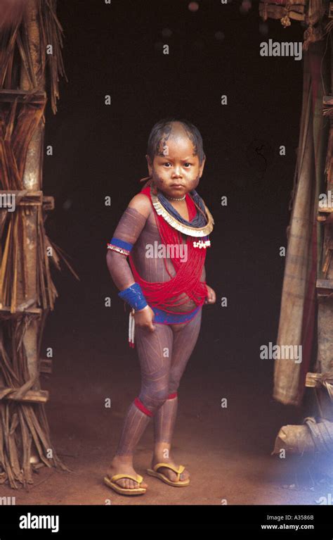 A Ukre Village Brazil Kayapo Girl With Beads And Black Body Paint Stock Photo Alamy