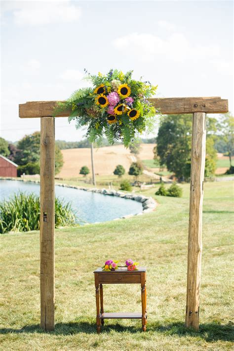 Wooden Wedding Arch With Sunflowers Pink Hydrangeas And Pink Aster