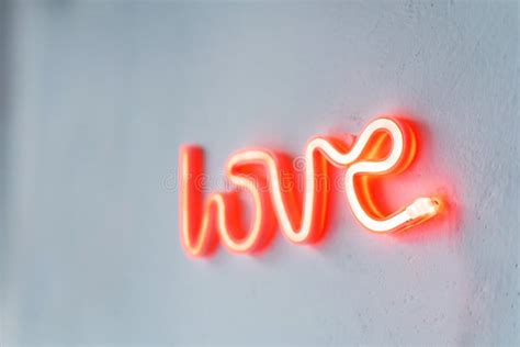 Red Neon Love Sign On A White Wall Stock Photo Image Of Color