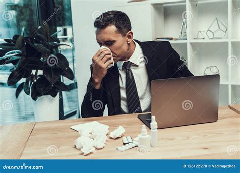 Sick Man In Suit With Scarf Sitting In Office Stock Photo Image Of