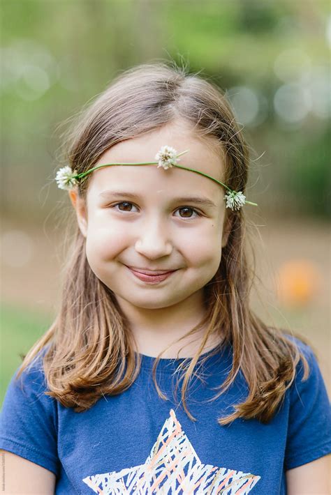 Cute Young Girl Wearing Headband Made Out Of White Clover Flower By Stocksy Contributor Jakob