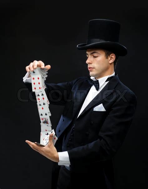 Magician Showing Trick With Playing Cards Stock Photo Colourbox
