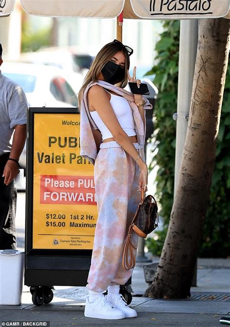 Madison Beer Flaunts Her Midriff In Crop Top As She Flashes A Peace