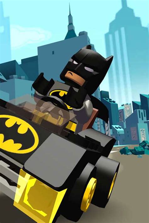 The Lego Batman Car Is Driving Down The Street In Front Of A Cityscape