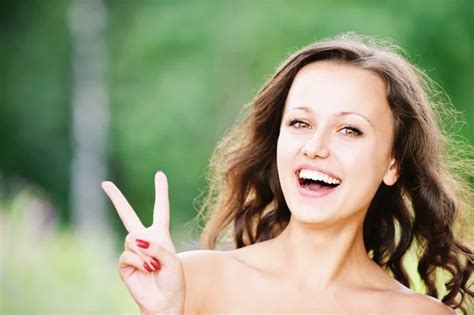 Portrait Of Pretty Woman Showing Peace Sign Stock Image Everypixel