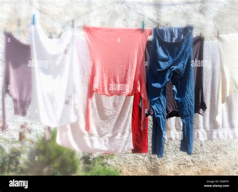 Clothing Hanging On Washing Line To Dry Stock Photo Alamy