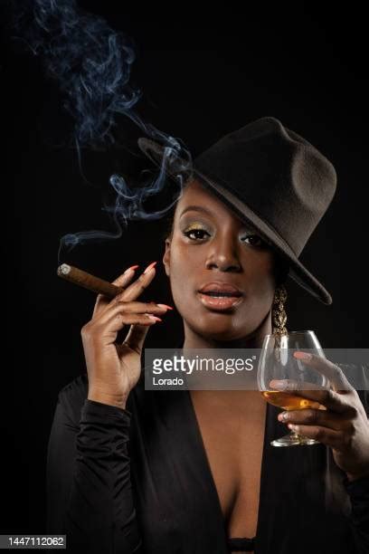 Black Woman Smoking Cigar Photos And Premium High Res Pictures Getty