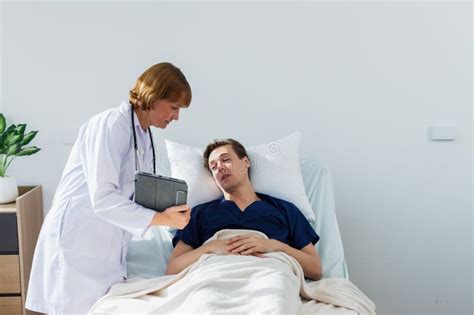 The Doctor Is Examining The Patient In The Hospital Caucasian Female