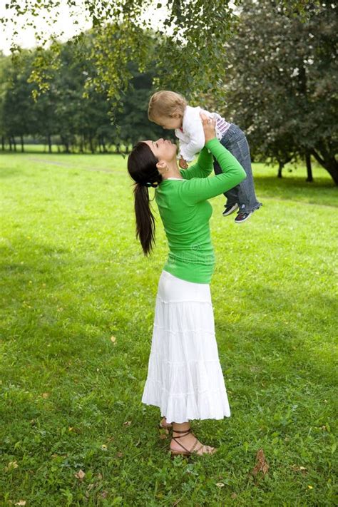 Mother And Daughter Taking A Walk In The Park Stock Photo Image Of