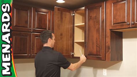 Place the wall corner cabinet at the desired height, measuring from the floor to the bottom of place cabinets upright and install spacer blocks between side panels, making sure spacers are flush with top and back of cabinet. Kitchen Cabinet Installation - How To - Menards - YouTube