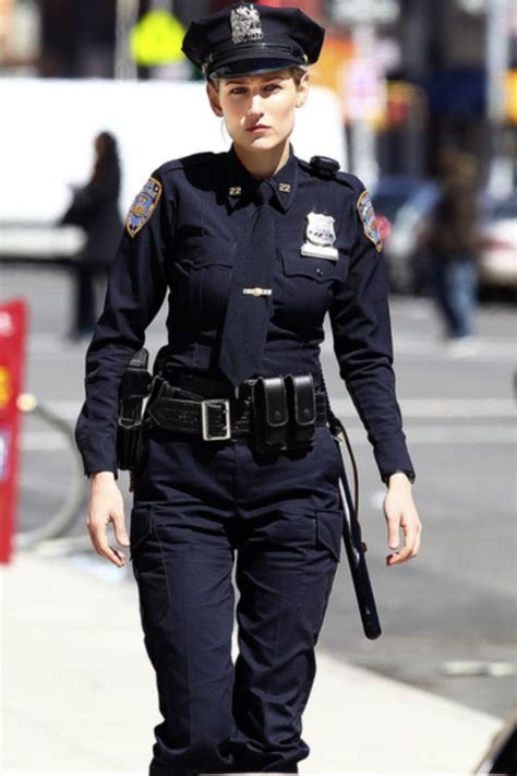 Female Police Officer Walking Down The Street