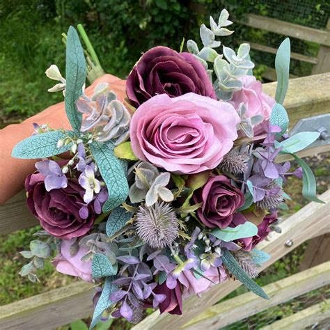 A Wedding Bouquet Of Artificial Mauvepink And Burgundy Roses Abigailrose