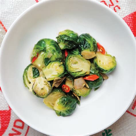 Brussels sprouts fried crisp and glazed with sweet honey, citrus flavors, and fiery sriracha. Stir-Fried Brussels Sprouts with Garlic and Chile recipe | Epicurious.com