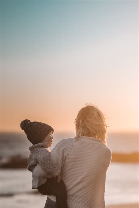 Photo Of Woman Carrying Child · Free Stock Photo