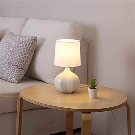 There are many lamps to choose from that will make your bedroom atmosphere cozy, chic and comfortable. SOTTAE Modern Style Small Ceramic Milk Color Unique Desgin Bedside Table Lamp, Cute Desk Lamp ...
