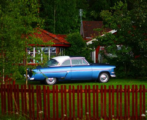 The Blue Car Parked In The Green Garden In Front Of The Re Flickr