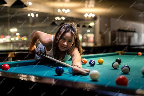 Premium Photo Attractive Woman Hold Cue And Playing Billiards