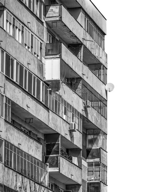 Worn Out Apartment Building From The Communist Era Against Blue Sky In Bucharest Romania Stock