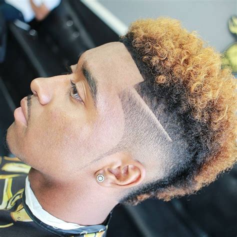 The faux hawk style, also known as the fohawk, has quickly become one of the most accepted lighten hairstyle for men. faux hawk hairstyle for men short hair | Taper fade afro ...