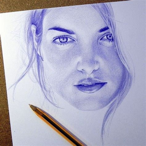 A Pencil Drawing Of A Womans Face On Paper With A Pen Next To It