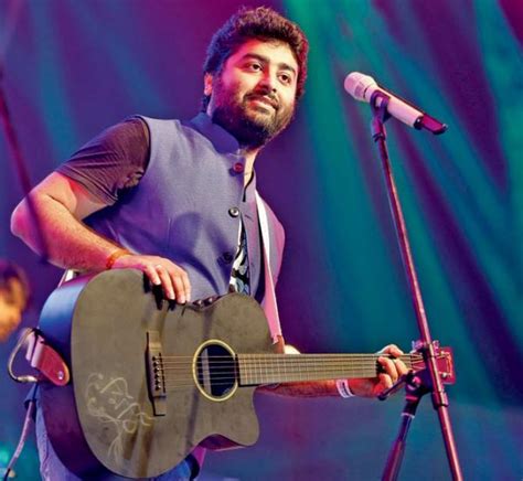 Here we can find arijit singh playing a guitar. Indian Musician Arijit Singh Photo | Veethi