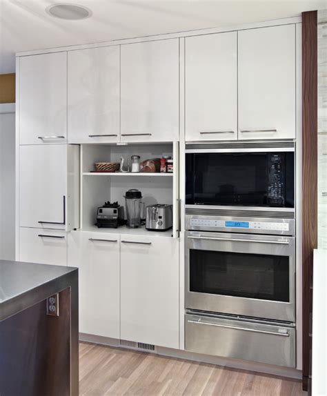 An appliance garage cabinet can be any space that tucks countertop appliances—think microwaves, toasters, coffeemakers, and the like—out of sight. Sleek appliance garage - Contemporary - Kitchen ...
