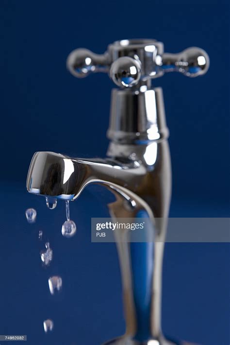 Tap Dripping Water Drops Closeup High Res Stock Photo