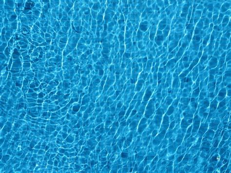 Premium Photo Top View Swimming Pool Water Background With Caustic Ripple And Sunlight Glare