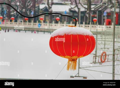 Explore the allure of traditional lanterns in a sunlit Chinese street
